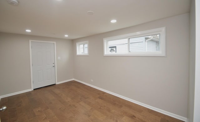 empty room with hardwood / wood-style flooring