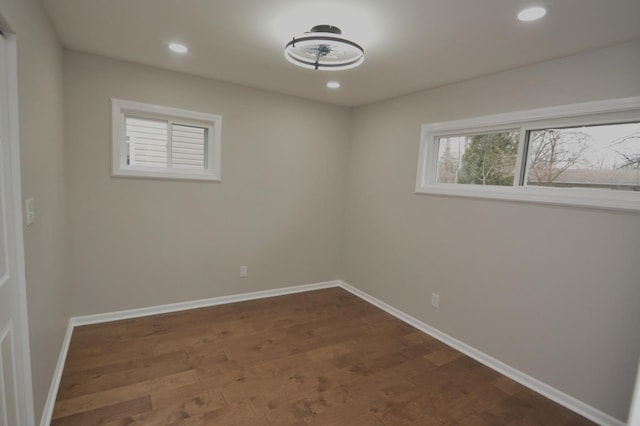 empty room with dark hardwood / wood-style floors