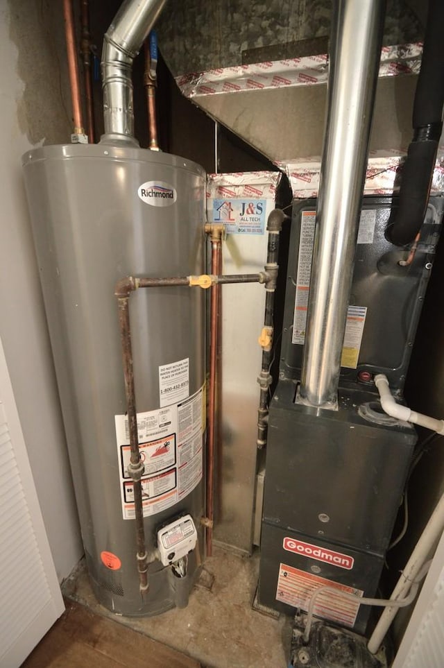 utility room with gas water heater