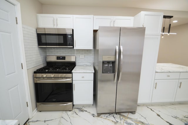 kitchen featuring appliances with stainless steel finishes and white cabinetry