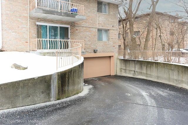 view of patio / terrace with a balcony and a garage