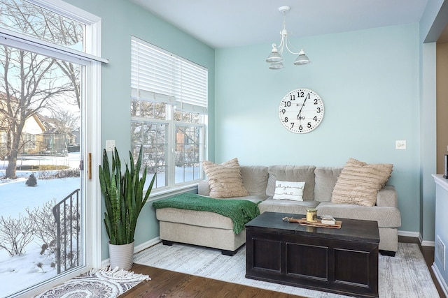 living room featuring a chandelier and hardwood / wood-style flooring