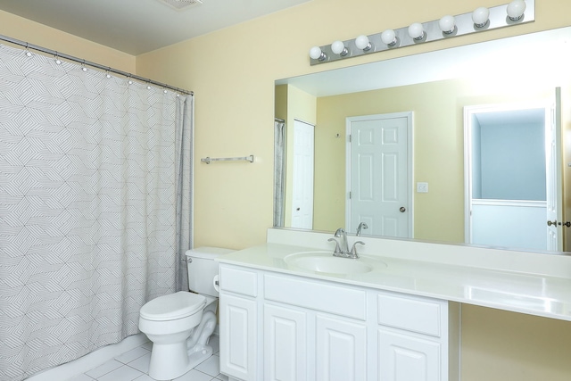 bathroom featuring tile patterned floors, vanity, and toilet