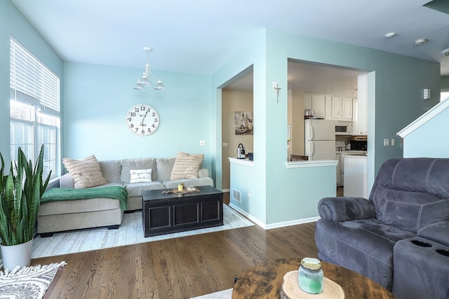 living room with dark hardwood / wood-style floors