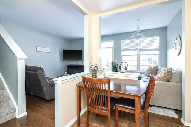 dining room with dark wood-type flooring