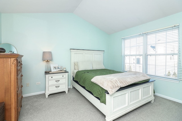 carpeted bedroom with vaulted ceiling