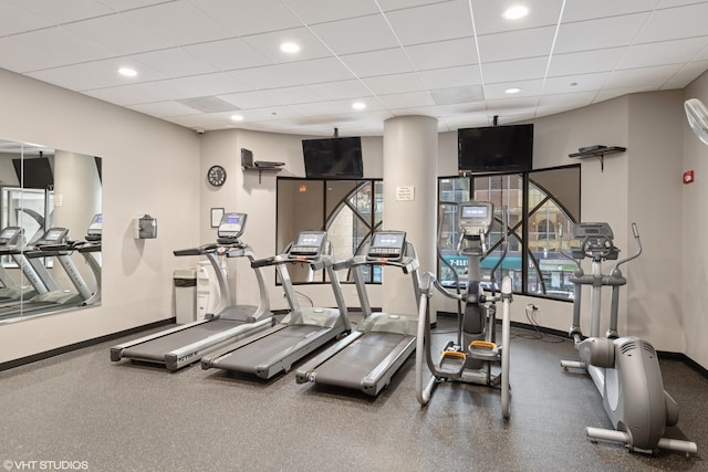 exercise room with a paneled ceiling