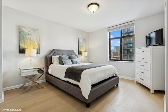 bedroom with light hardwood / wood-style floors