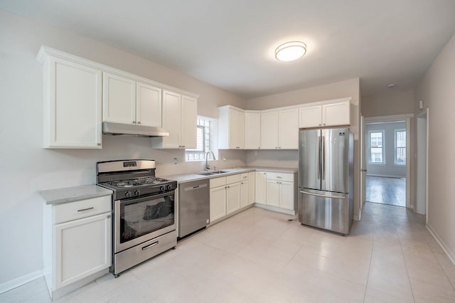 kitchen with white cabinetry, appliances with stainless steel finishes, and sink