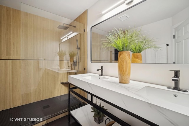 bathroom featuring vanity and a shower