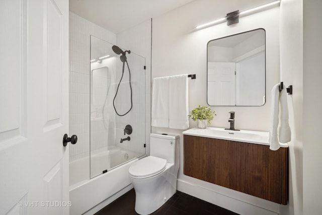 full bathroom with vanity, toilet, and bath / shower combo with glass door