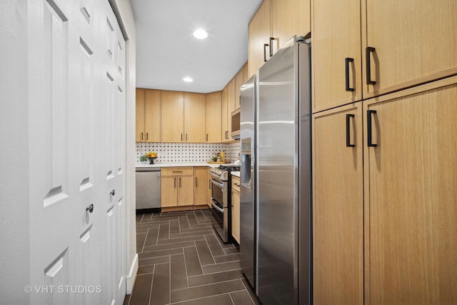 kitchen with tasteful backsplash, light brown cabinetry, and appliances with stainless steel finishes