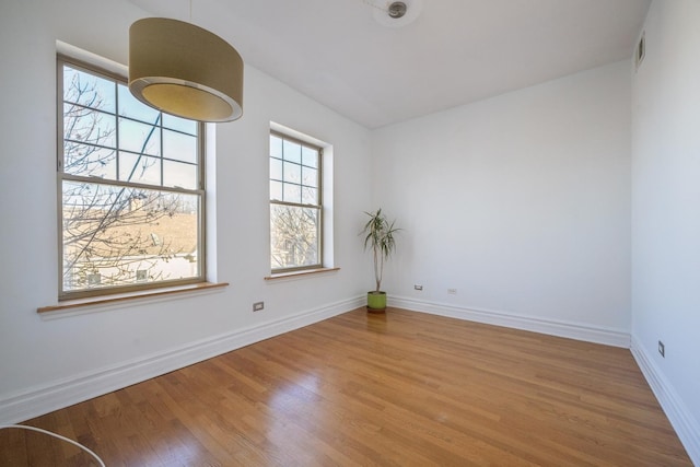 empty room with wood-type flooring