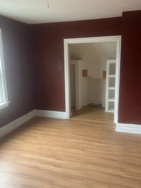 spare room with light wood-type flooring