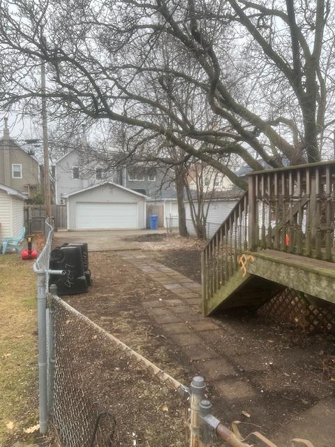 exterior space with an outbuilding and a garage