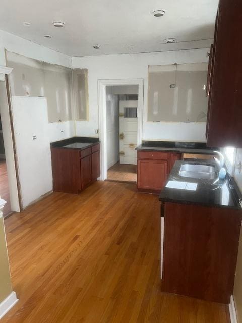 kitchen with dark wood-type flooring and sink