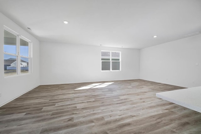 spare room with wood-type flooring