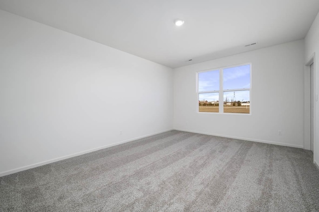 spare room with carpet floors