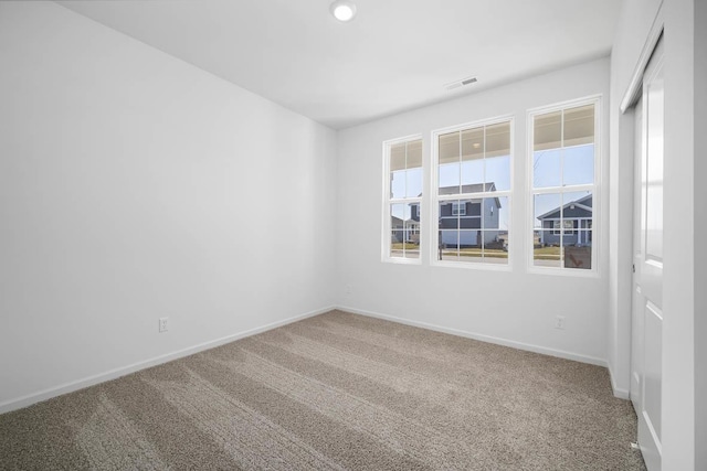 empty room with carpet flooring