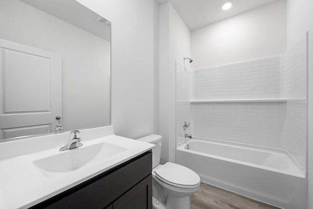 full bathroom featuring vanity, toilet, shower / bathing tub combination, and hardwood / wood-style flooring