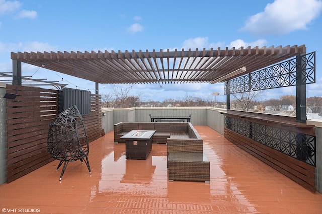 view of patio featuring a pergola, an outdoor living space with a fire pit, and a deck