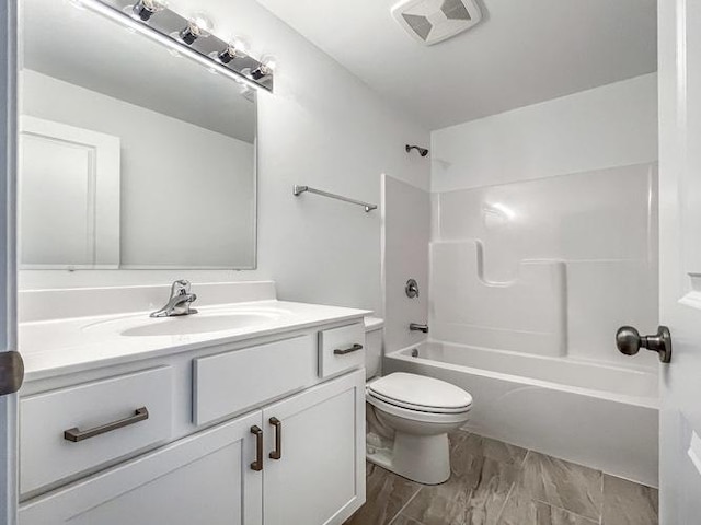 full bathroom with bathing tub / shower combination, vanity, and toilet