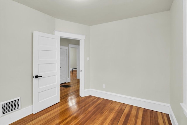 empty room featuring hardwood / wood-style floors