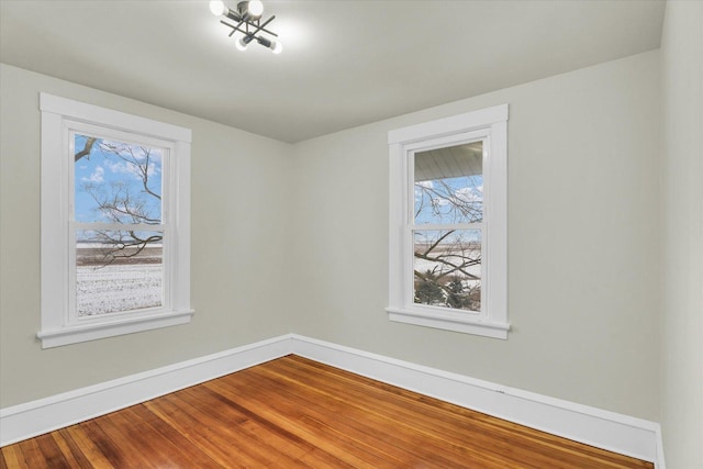 unfurnished room featuring wood-type flooring