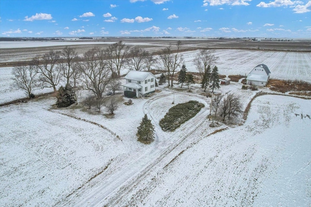 snowy aerial view featuring a rural view