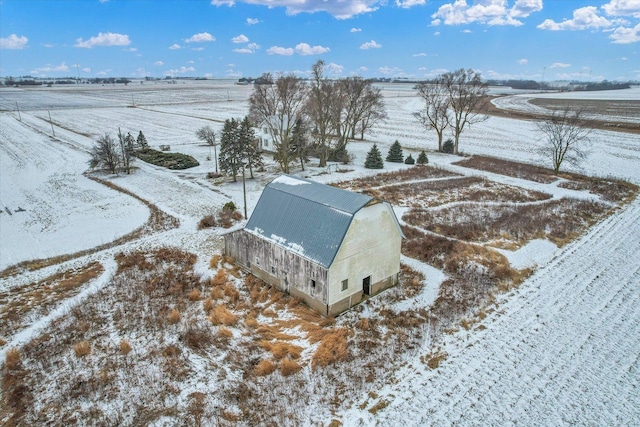 snowy aerial view featuring a rural view