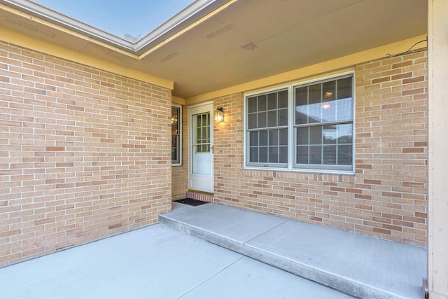 property entrance featuring a patio area