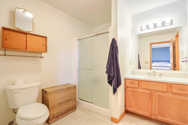 bathroom with toilet, a shower with shower door, and tile patterned flooring