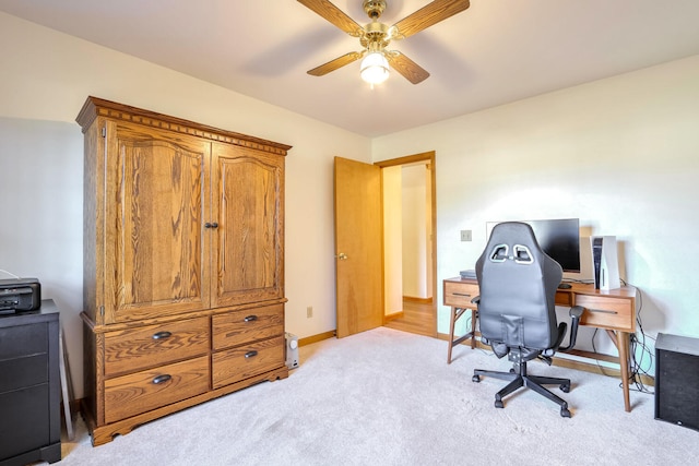 carpeted office with ceiling fan