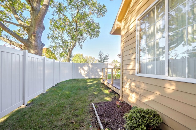 view of yard featuring a wooden deck