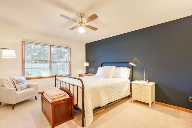 bedroom with light colored carpet and ceiling fan