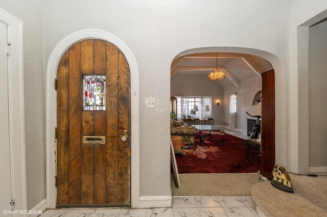 foyer featuring lofted ceiling