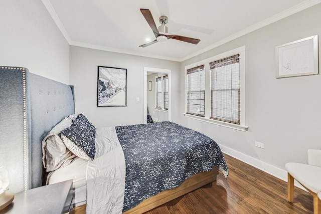 bedroom featuring hardwood / wood-style flooring, ceiling fan, and crown molding