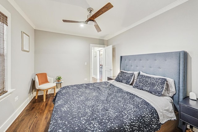 bedroom featuring ceiling fan, dark hardwood / wood-style flooring, and crown molding