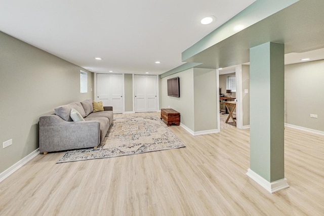 living room with light hardwood / wood-style flooring