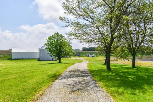 8 Fraher Dr, Odell, IL 60460 - view of community with a yard, a pole building, and an outbuilding