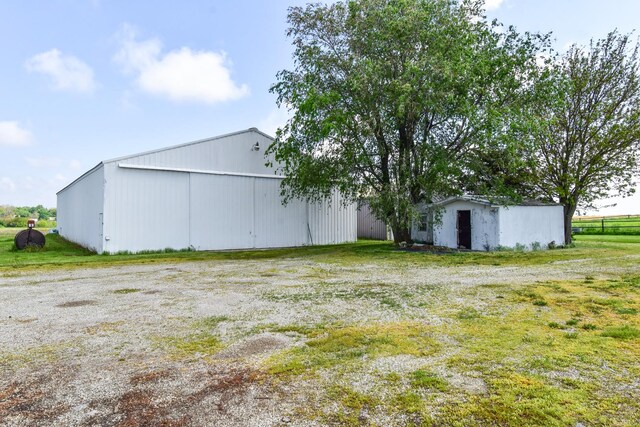 8 Fraher Dr, Odell, IL 60460 - view of yard featuring a pole building, a detached garage, and an outdoor structure