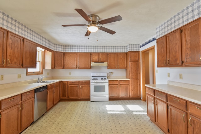 kitchen featuring white gas range, sink, stainless steel dishwasher, ceiling fan, and a textured ceiling