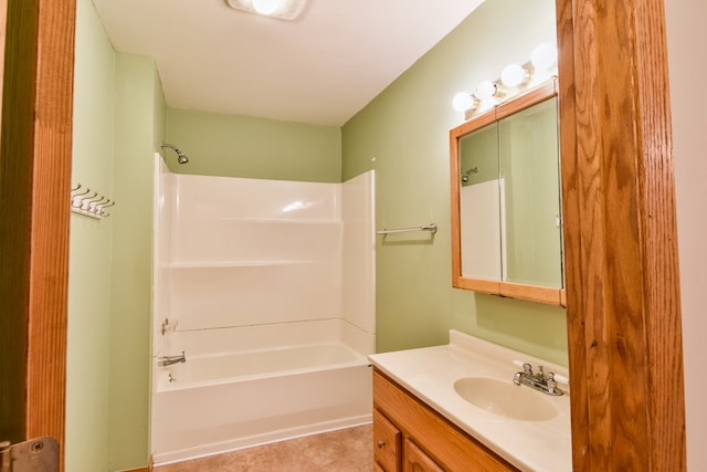 bathroom featuring vanity, tile patterned floors, and washtub / shower combination