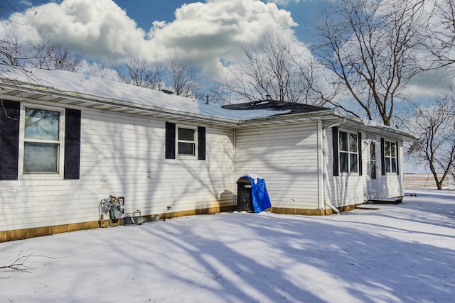 view of snow covered property