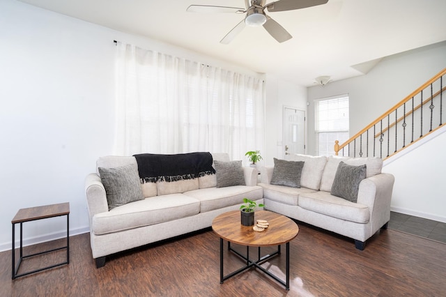 living room featuring dark hardwood / wood-style floors and ceiling fan