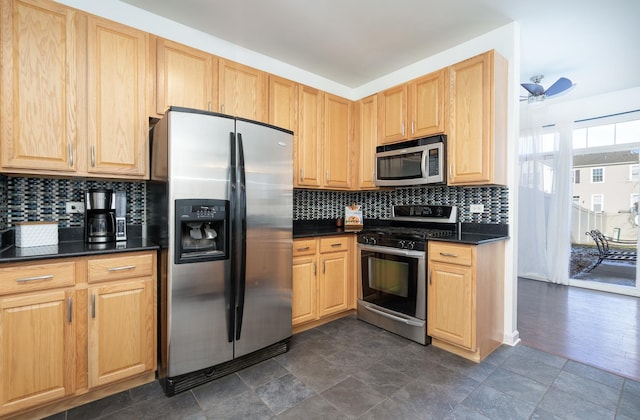 kitchen with backsplash, ceiling fan, light brown cabinets, and appliances with stainless steel finishes