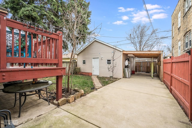 exterior space with a carport and a deck