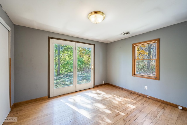 unfurnished room with light hardwood / wood-style floors