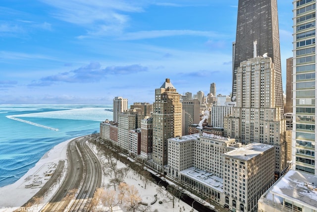 view of city featuring a beach view and a water view