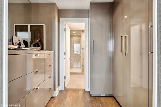 hallway with light hardwood / wood-style flooring